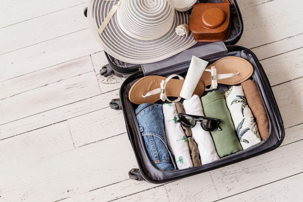Suitcase packing representing packing tips